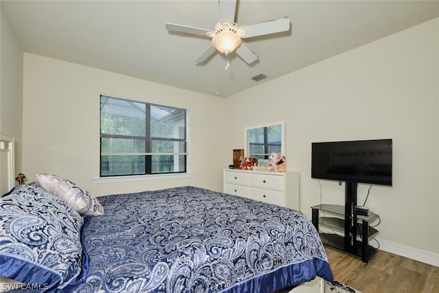 bedroom featuring hardwood / wood-style floors and ceiling fan