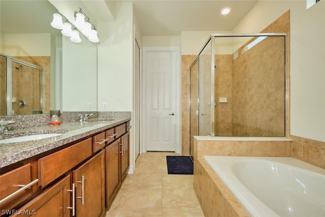 bathroom featuring separate shower and tub, tile patterned flooring, and vanity