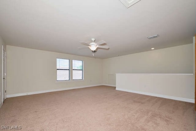 unfurnished room featuring ceiling fan, baseboards, and light colored carpet