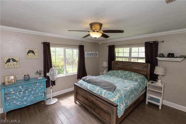 bedroom with ceiling fan, multiple windows, dark hardwood / wood-style flooring, and crown molding