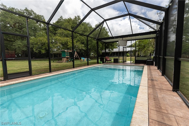 view of pool featuring a playground, a lanai, and a yard