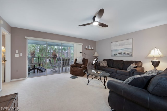 living room featuring ceiling fan and carpet floors