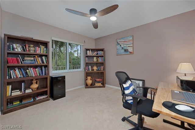 office featuring light colored carpet and ceiling fan