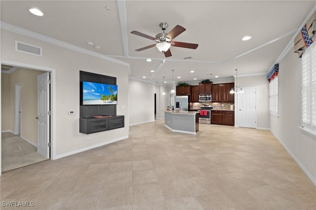 living room with light tile patterned floors, ceiling fan, and crown molding