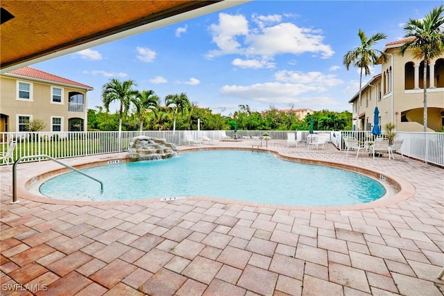 view of pool featuring a patio and pool water feature