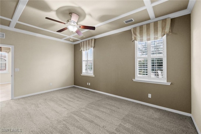 unfurnished room with carpet flooring, ceiling fan, a wealth of natural light, and coffered ceiling