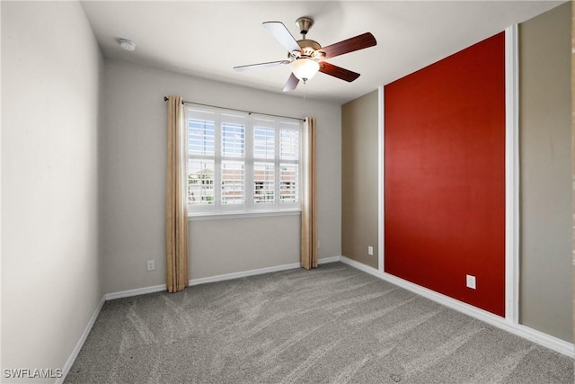 unfurnished room featuring carpet flooring and ceiling fan