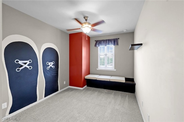 unfurnished bedroom featuring carpet flooring and ceiling fan