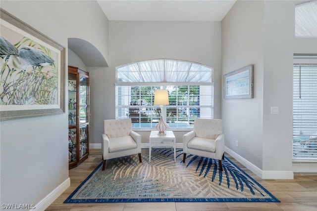 living area with hardwood / wood-style floors