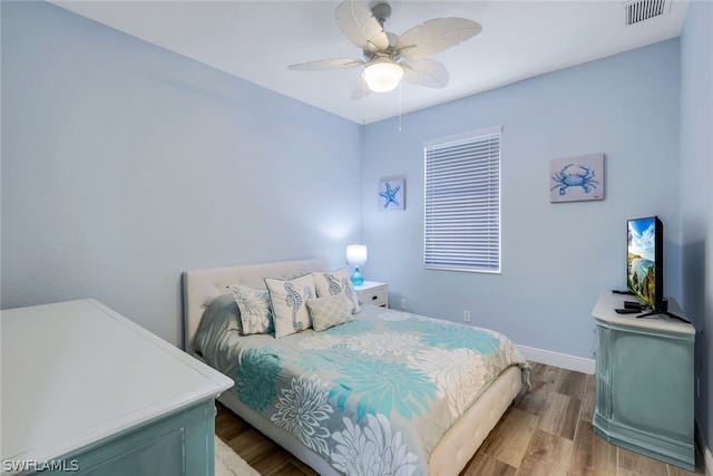 bedroom featuring hardwood / wood-style flooring and ceiling fan