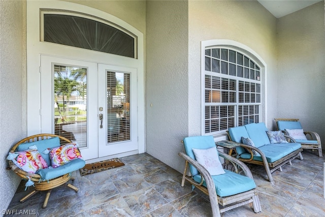 view of exterior entry featuring a patio