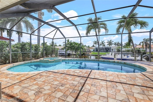 view of pool with a lanai and a patio area