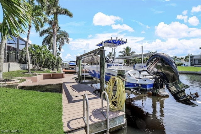 dock area with glass enclosure and a water view