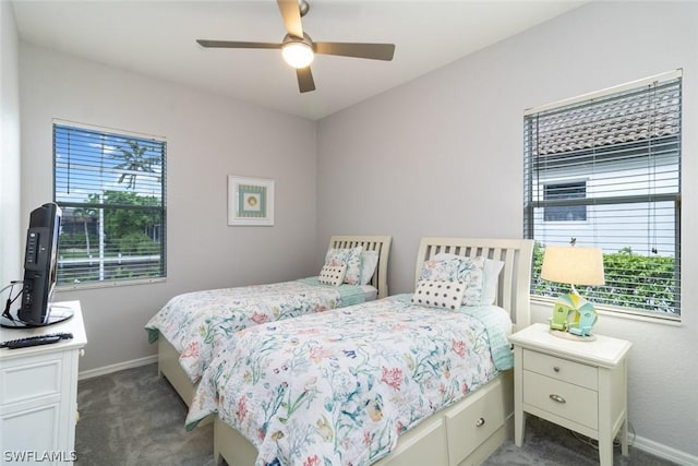 bedroom with dark carpet and ceiling fan