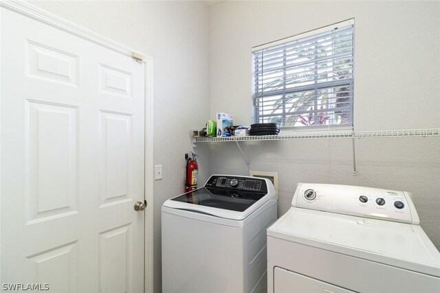 laundry room featuring washer and clothes dryer