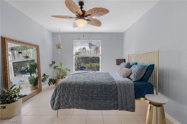 tiled bedroom with ceiling fan