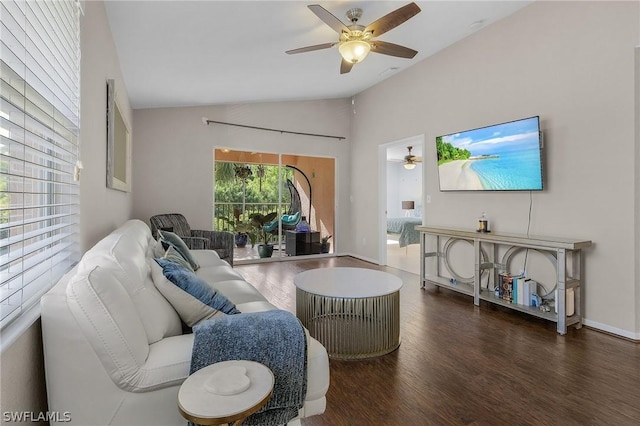 living room featuring vaulted ceiling, ceiling fan, and dark hardwood / wood-style floors