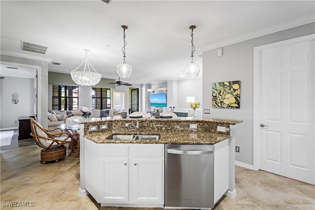 kitchen featuring white cabinets, decorative light fixtures, stainless steel dishwasher, and an island with sink