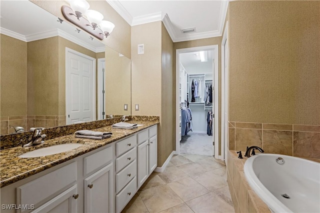 bathroom featuring vanity, tiled bath, and crown molding