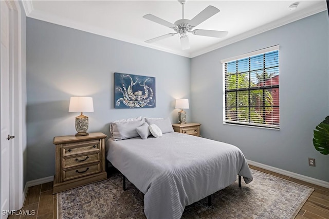 bedroom featuring ceiling fan, ornamental molding, and dark wood-type flooring