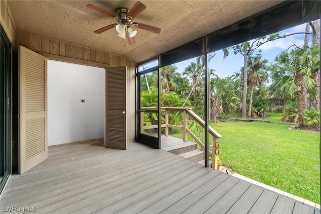 exterior space with ceiling fan and wooden ceiling