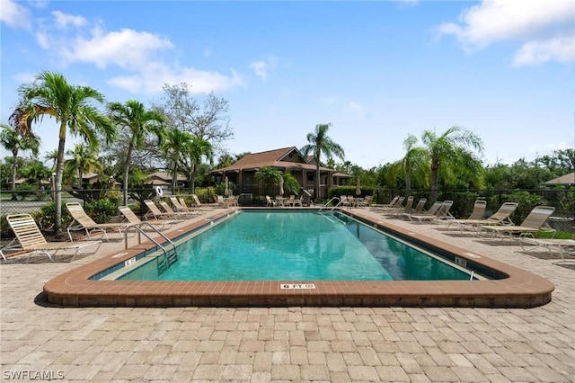 view of swimming pool with a patio