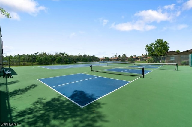 view of sport court with basketball hoop