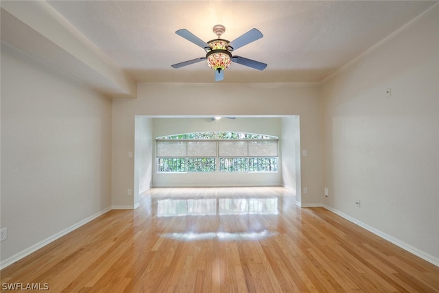 unfurnished living room with ceiling fan and light hardwood / wood-style floors