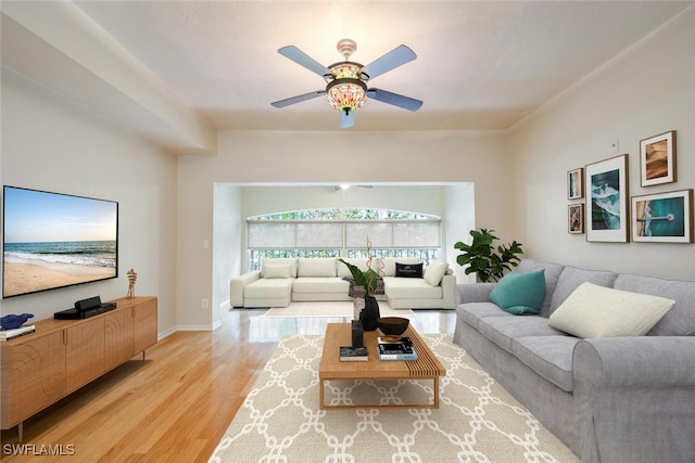 living room featuring ceiling fan and light hardwood / wood-style floors