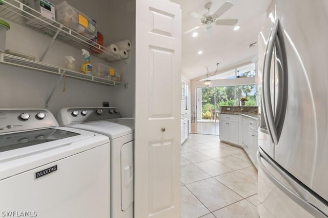 washroom featuring ceiling fan, light tile patterned flooring, and separate washer and dryer