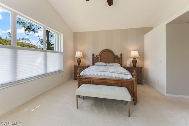 bedroom with light carpet, vaulted ceiling, and ceiling fan