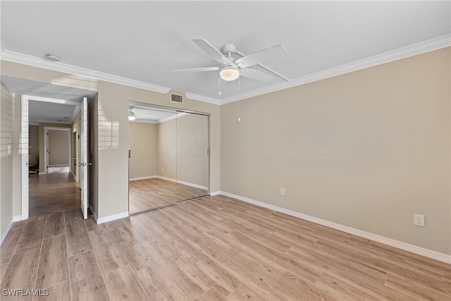 unfurnished bedroom featuring ceiling fan, a closet, ornamental molding, and light hardwood / wood-style flooring