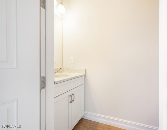 bathroom featuring vanity and wood-type flooring