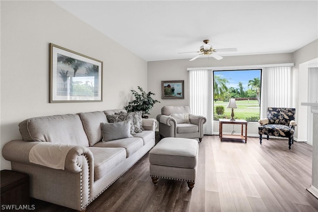 living room featuring ceiling fan and wood-type flooring