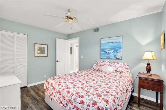 bedroom with ceiling fan, a closet, and dark hardwood / wood-style floors