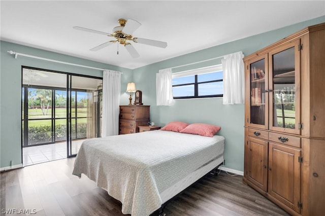 bedroom featuring access to exterior, ceiling fan, and dark hardwood / wood-style floors