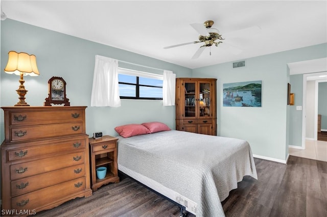 bedroom featuring dark hardwood / wood-style flooring and ceiling fan