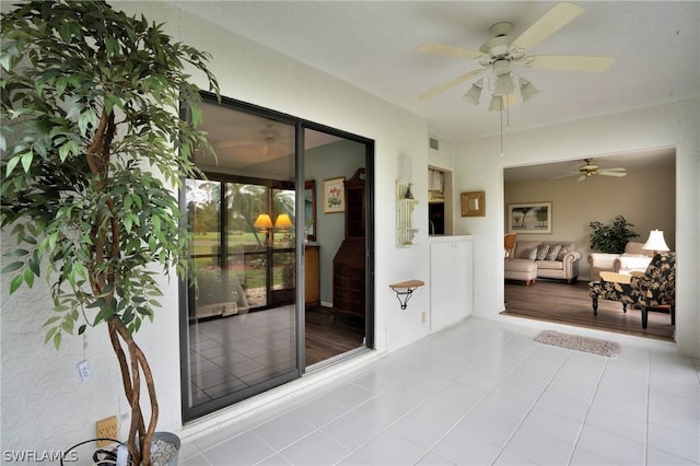 interior space featuring ceiling fan and an outdoor living space