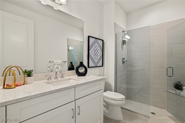 bathroom with vanity, walk in shower, and toilet