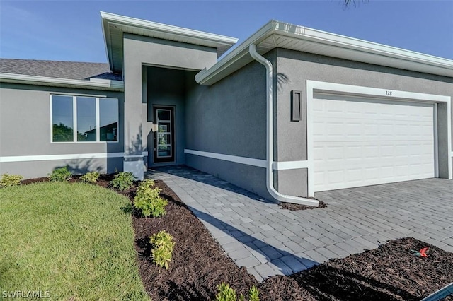 view of front of home with a garage and a front yard