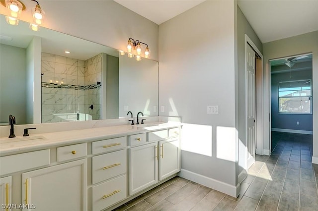 bathroom with vanity and a shower with shower door