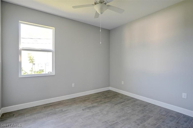 spare room featuring ceiling fan and light hardwood / wood-style floors