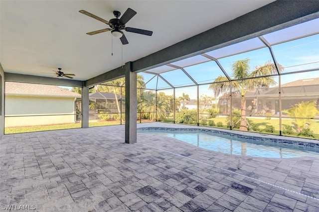 view of pool featuring a lanai, a patio area, and ceiling fan