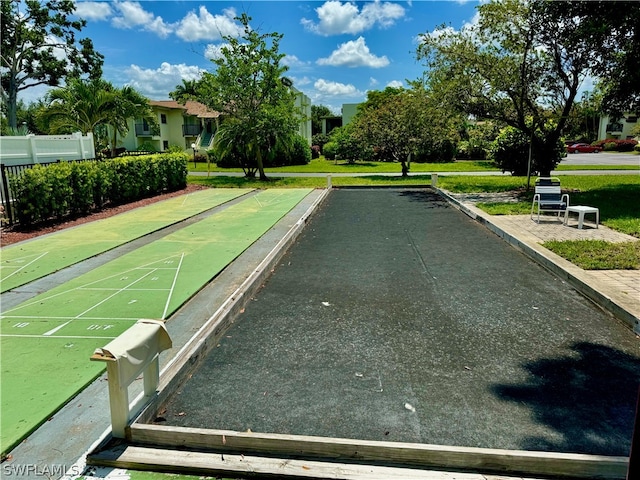 view of property's community with a yard