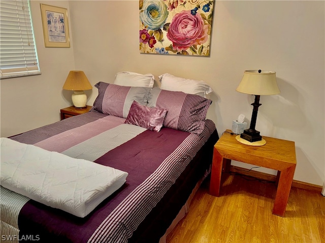 bedroom featuring hardwood / wood-style flooring