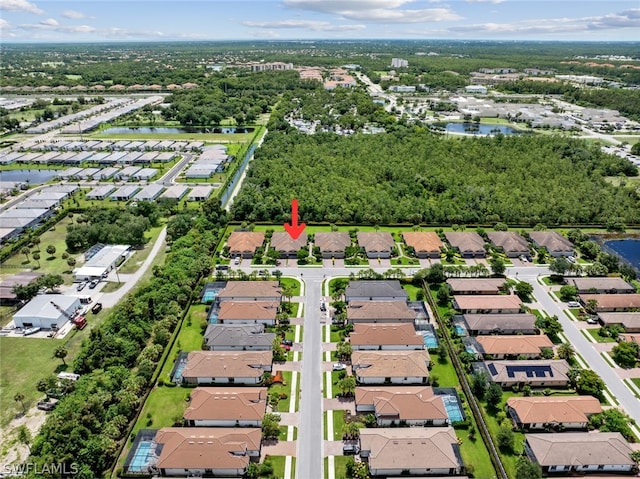 birds eye view of property featuring a residential view and a water view