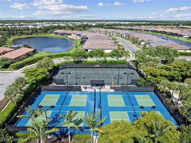 birds eye view of property with a residential view and a water view