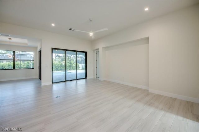 empty room featuring light hardwood / wood-style floors and ceiling fan