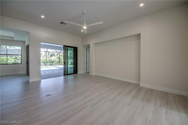 unfurnished room with light hardwood / wood-style floors and ceiling fan