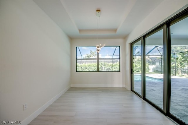 interior space with a raised ceiling